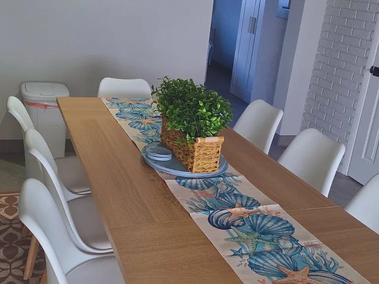 Spacious dining setup for 8-person seating.
