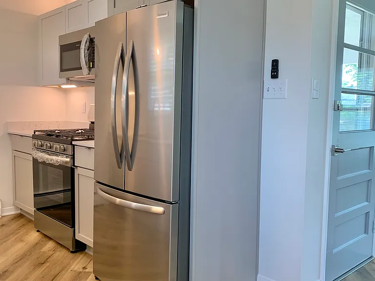 Kitchen and side entry from carport