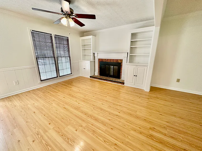 Family Room with Gas Fireplace with custom shelving.