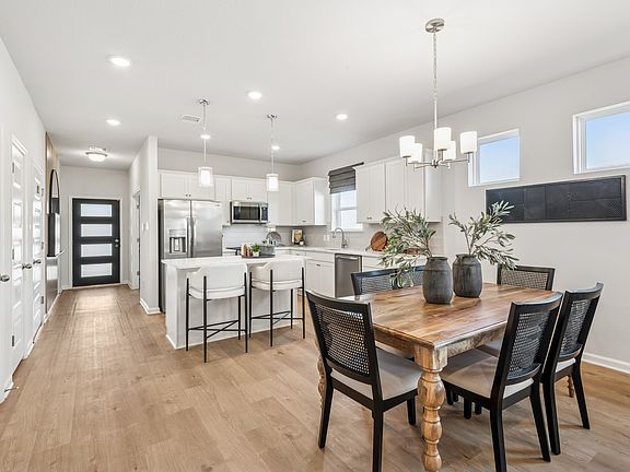 Kitchen and Dining Area. Staged model home shown for illustration only actual features, colors, an