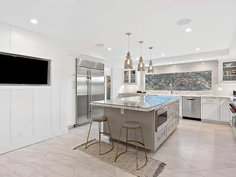 State of the Art appliances and sub zero refrigerator compliment this modern kitchen.
