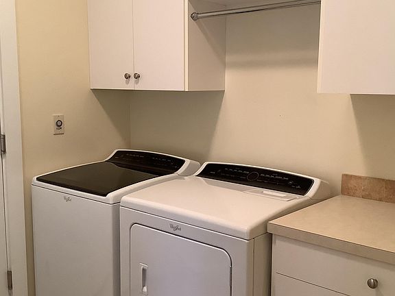 Washer and dryer included in laundry room.