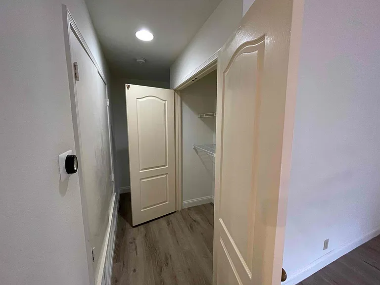 Double wide closet for storage and NEST thermostat.