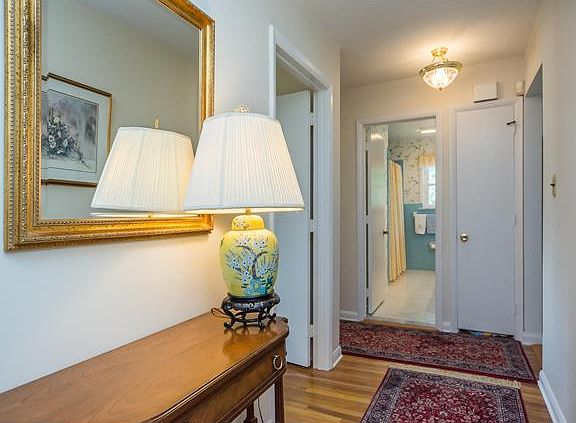 Foyer leads to bedroom hallway w/ hardwoods
