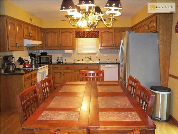 The dining area in the kitchen/dining combo has plenty of room for guests.
