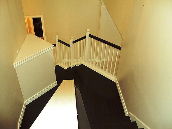 Dual Stairway Entrance From Foyer & Kitchen