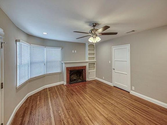 View of the living room and fireplace as seen from the front door