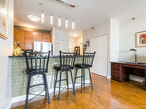 Ample seating at the breakfast bar with New subway tile to match the backsplash.