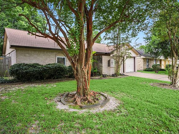 Mature landscaped yard with beautiful curb appeal