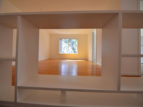Upstairs living room through bookshelf
