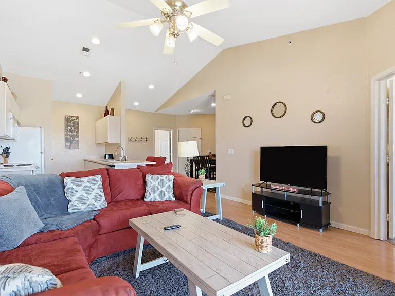 Fully furnished living area with 60in smart tv