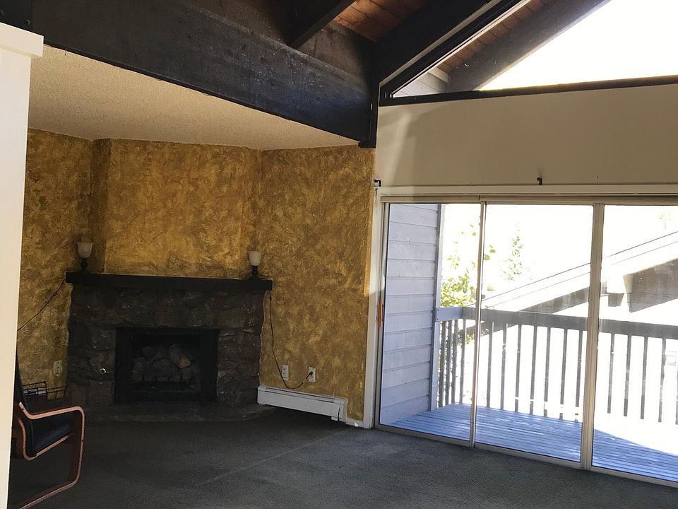 dining room -living room with triple slider to the deck