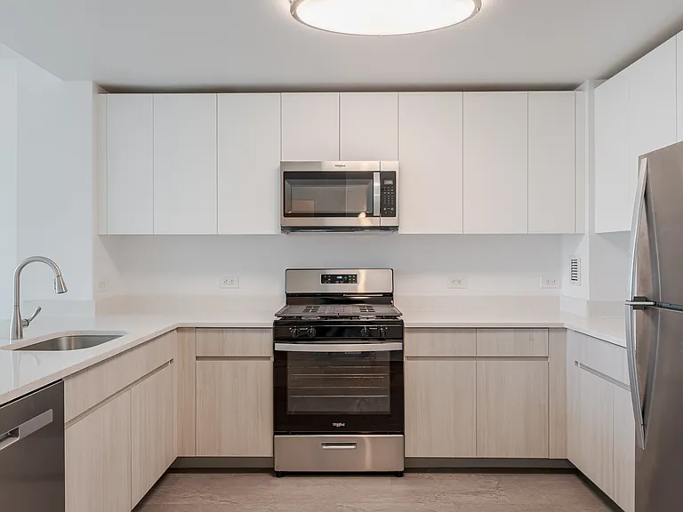 Sleek stainless steel appliances and modern cabinetry