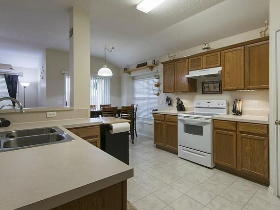 Functionally kitchen has ample countertop space and cabinet.