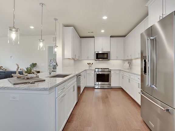 Kitchen with Peninsula Island Provides Ample Workspace and Storage