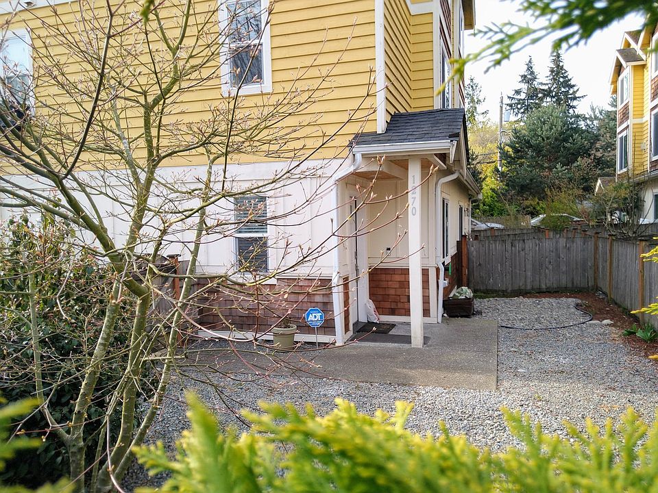 Entrance surrounded by a private, fenced in yard