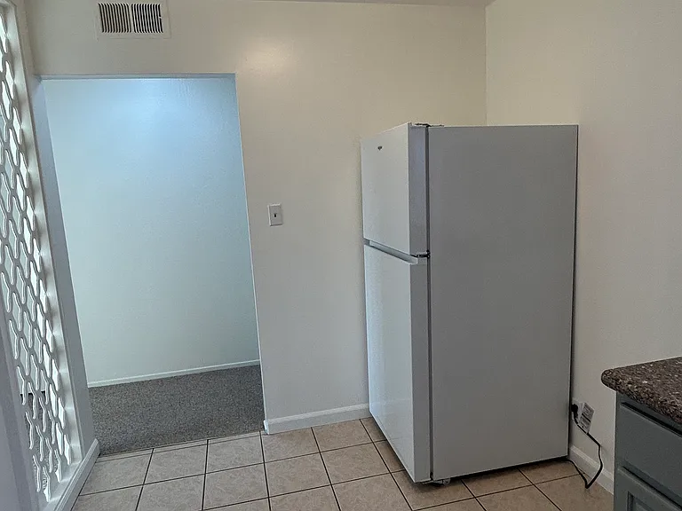 kitchen is spacious enough to accommodate a breakfast or counter/table.