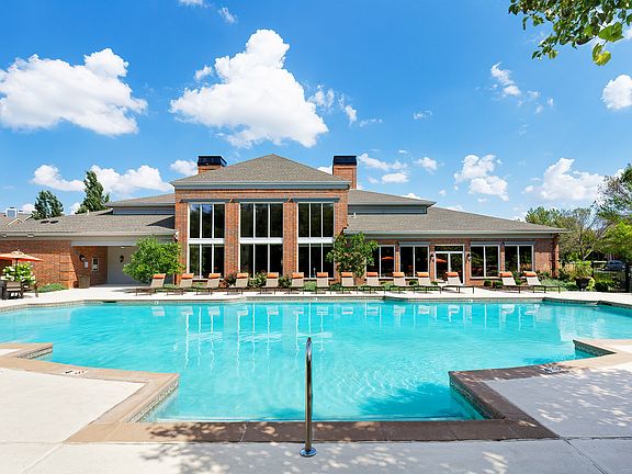 Resort-style swimming pool with expansive lounge deck