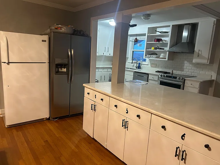 Updated kitchen with ample counter space, stainless-steel range, and generous cabinetry for everyday storage and prep.