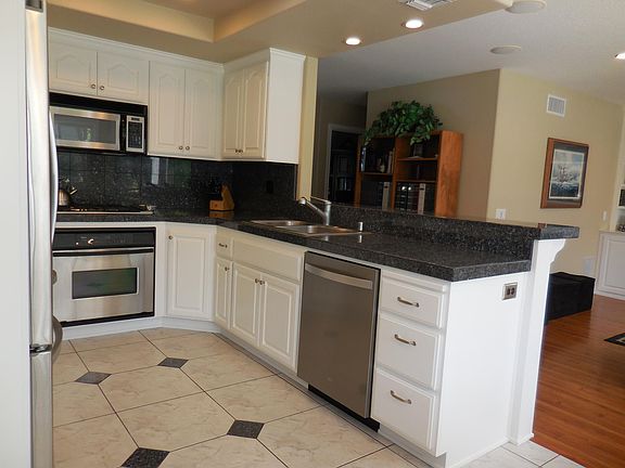 Kitchen w/ Bar open to Family Room