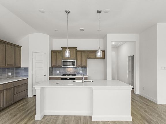 Trenton one-story floor plan featuring 3 bedrooms, 2 bathrooms, open-concept living and dining space