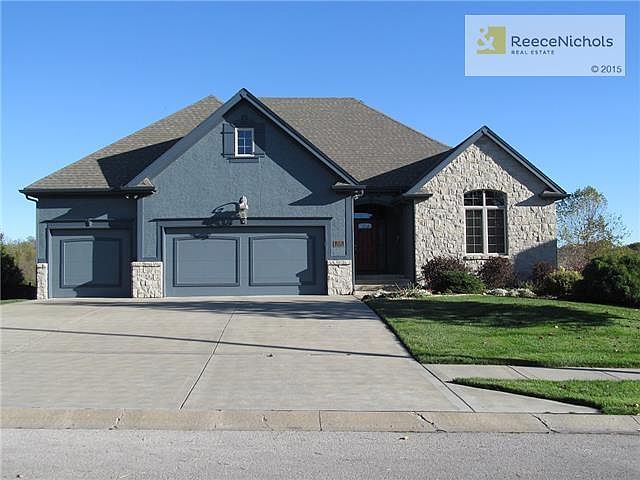 FRONT VIEW OF HOME, REAL STONE TRIM