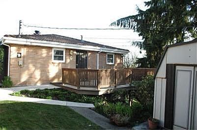 Private deck on backside of home off kitchen offers a great place for those summer evening dinners. 