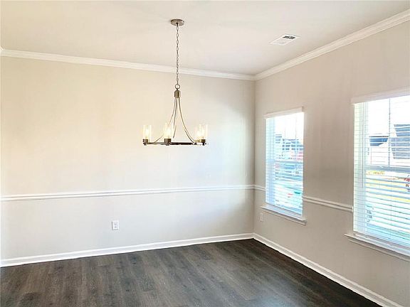 Large Dining Room with modern columns flanking the entrance