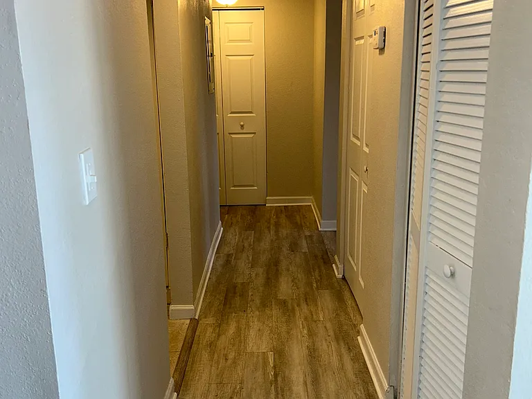 Hallway W/ Closet Spaces