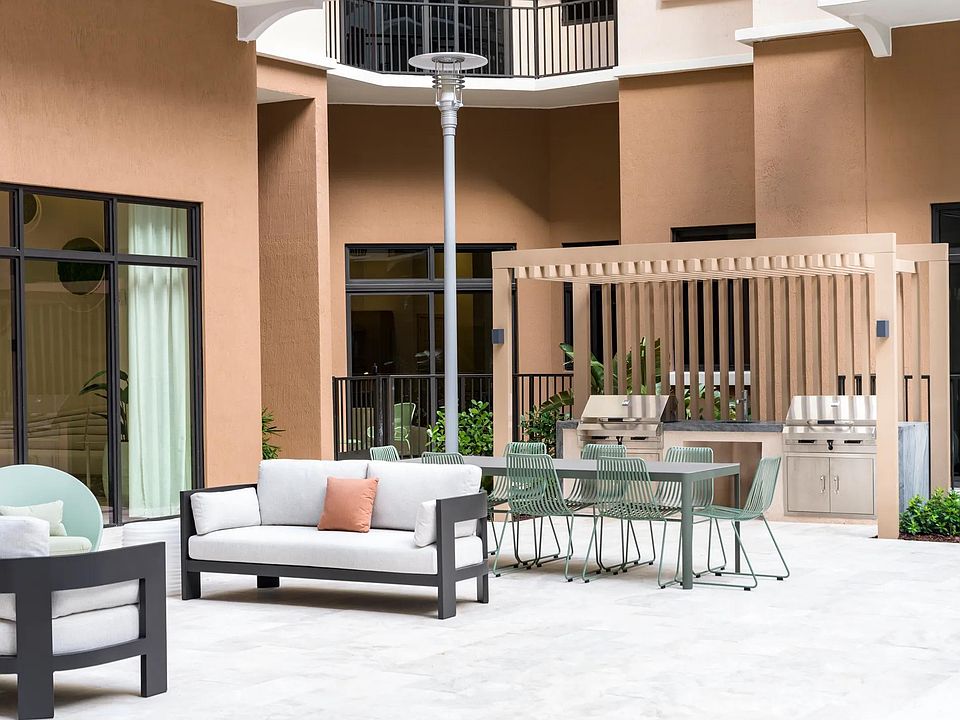 Savor every moment with an outdoor kitchen and grill by the pool.