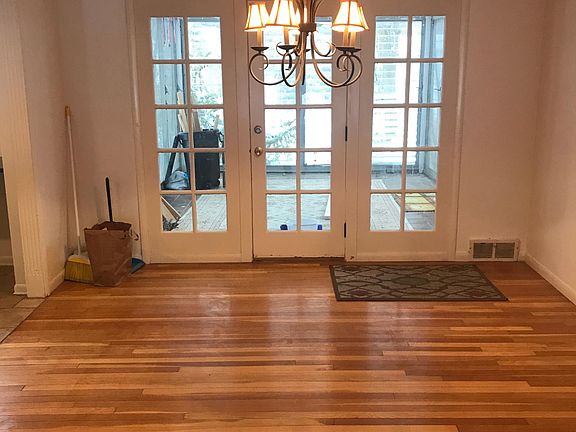 Formal dining room with access to enclosed three season room.