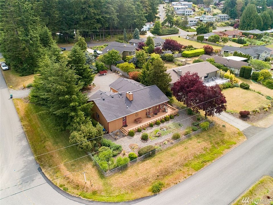 51 Sunset Boulevard sits on a large corner lot in the heart of Cape George Colony.  