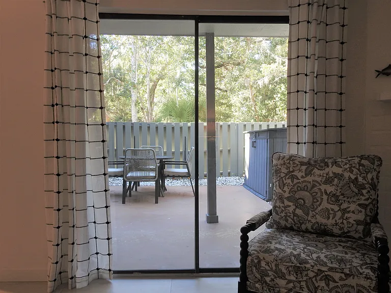View from living room out to patio through brand new easy glide slider