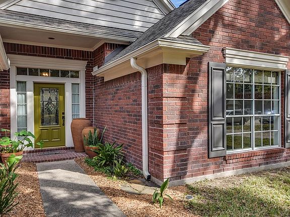 Welcoming glass leaded door with transom windows greet you as you enter this delightful home
