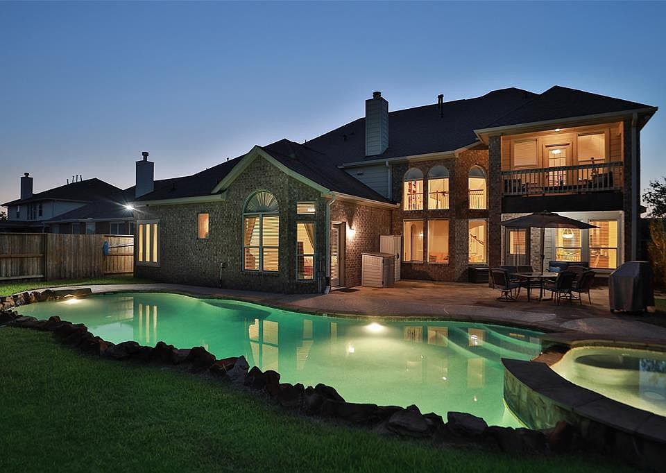 Inviting night time swims are enticing in this beautiful pool.