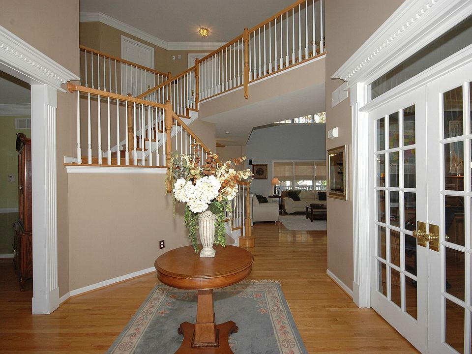 2-Story Foyer With Glass Doors To Living Room/Office.