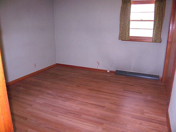 One of 3 bedrooms-hardwoods showing