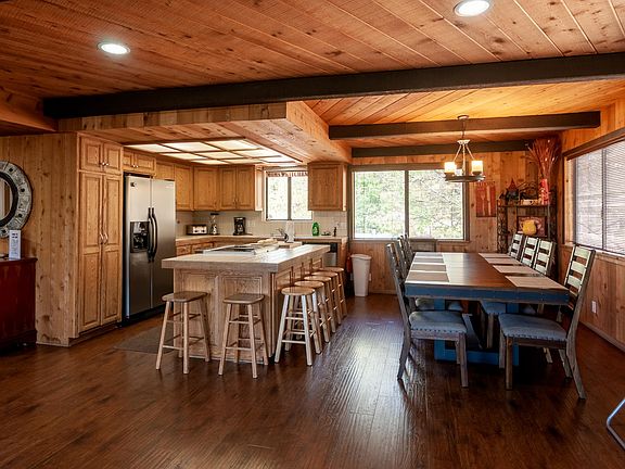 Open Kitchen and dining area for 8. Convenient breakfast bar sitting.