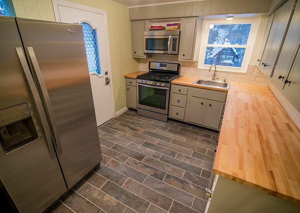 Italian slate floors, butcher block top, stainless appliance