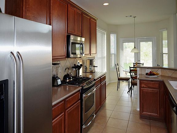 Open kitchen with plenty of cabinets.