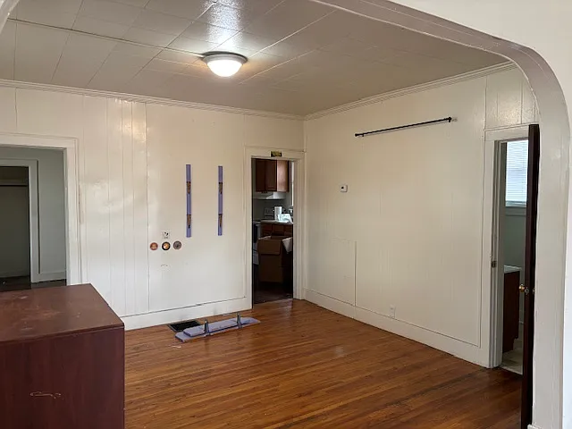 Dining room (from living room, looking toward kitchen. Door on the right is bathroom.)