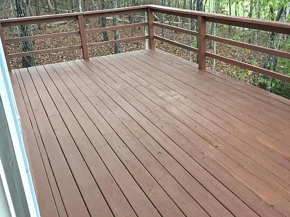 NICE OUTDOOR SPACE OVERLOOKING GOLF COURSE AND WOODED AREA
