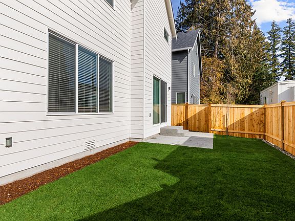 Landscaped and fenced backyard