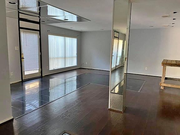 entry way and living room area with patio access