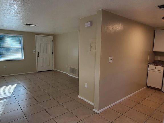 View from Dining into Living room and into Kitchen
