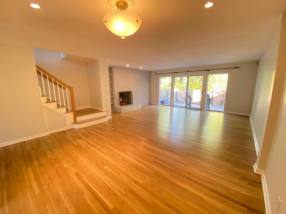 Main Living Area and Fireplace, sliders to the Private Patio (unfurnished)