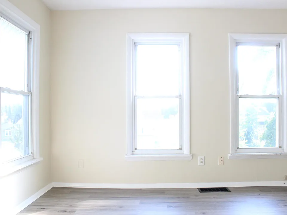 The living room has a ton of natural daylight and views to a portion of the downtown skyline.