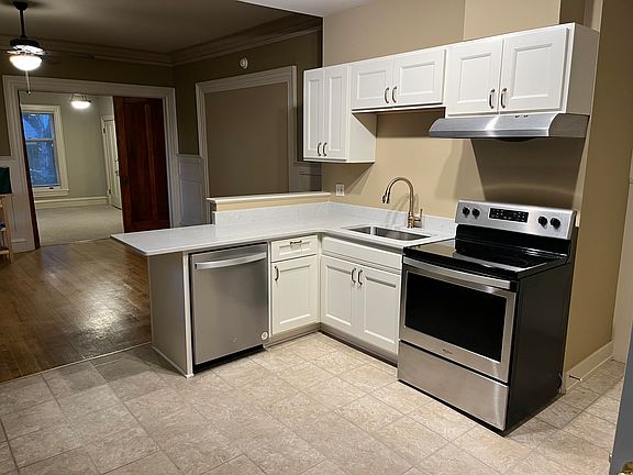 Brand new kitchen with soft close cabinets, quartz countertop, and dishwasher