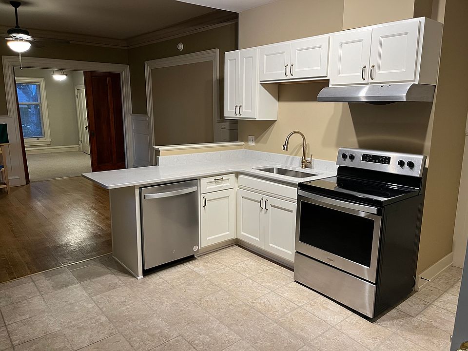 Brand new kitchen with soft close cabinets, quartz countertop, and dishwasher