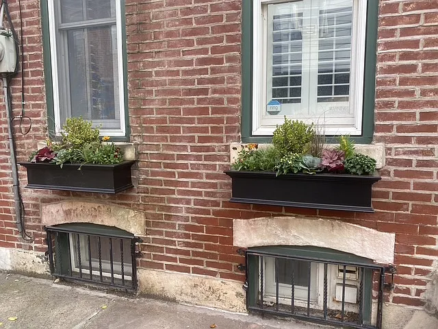 Window boxes and new shutters add a touch of curbside charm.